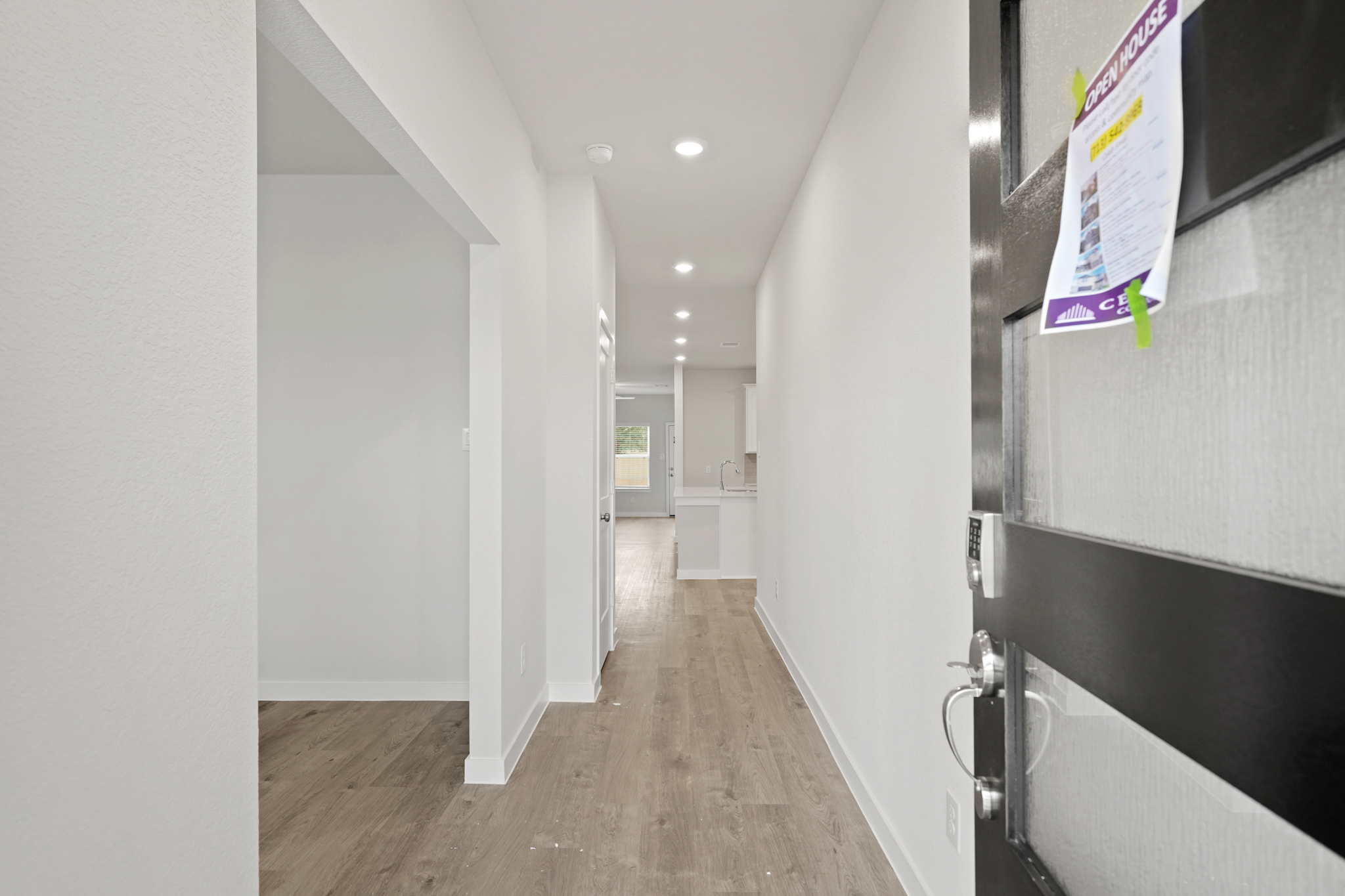 A hallway with white walls.