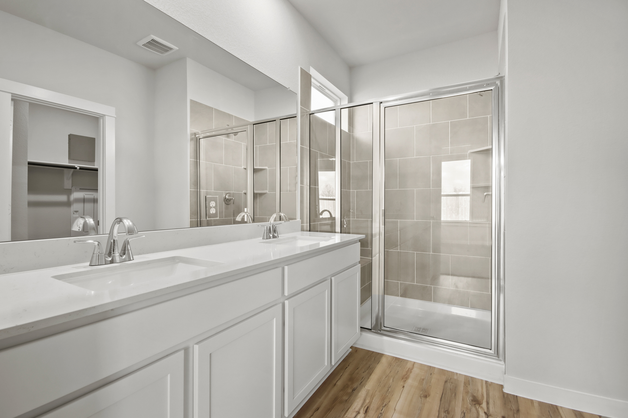 A bathroom with a glass shower.