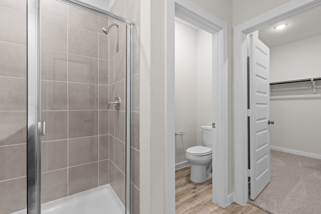 A bathroom with a glass shower.