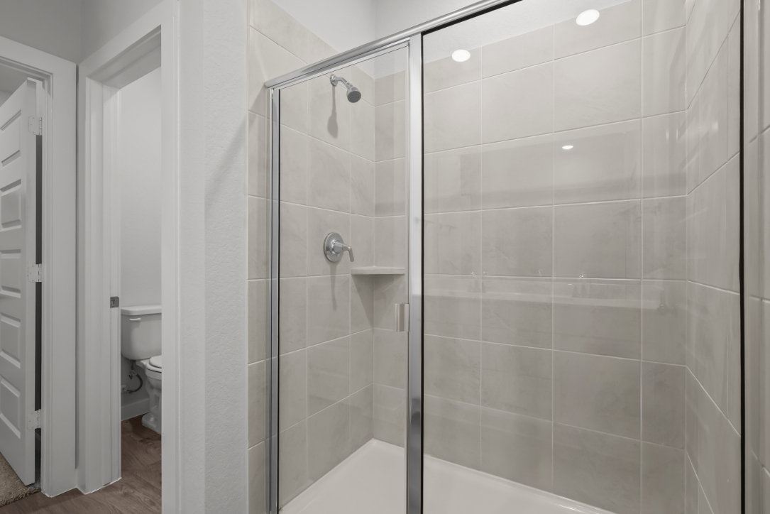 A bathroom with a glass shower.
