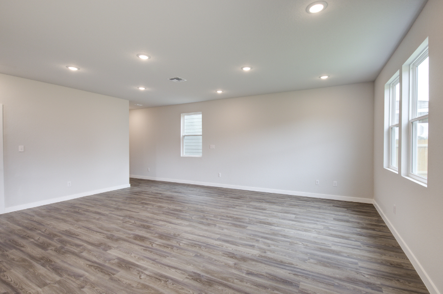 A room with a wood floor and a wood floor.