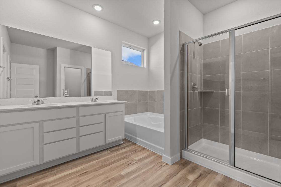 A bathroom with a glass shower.
