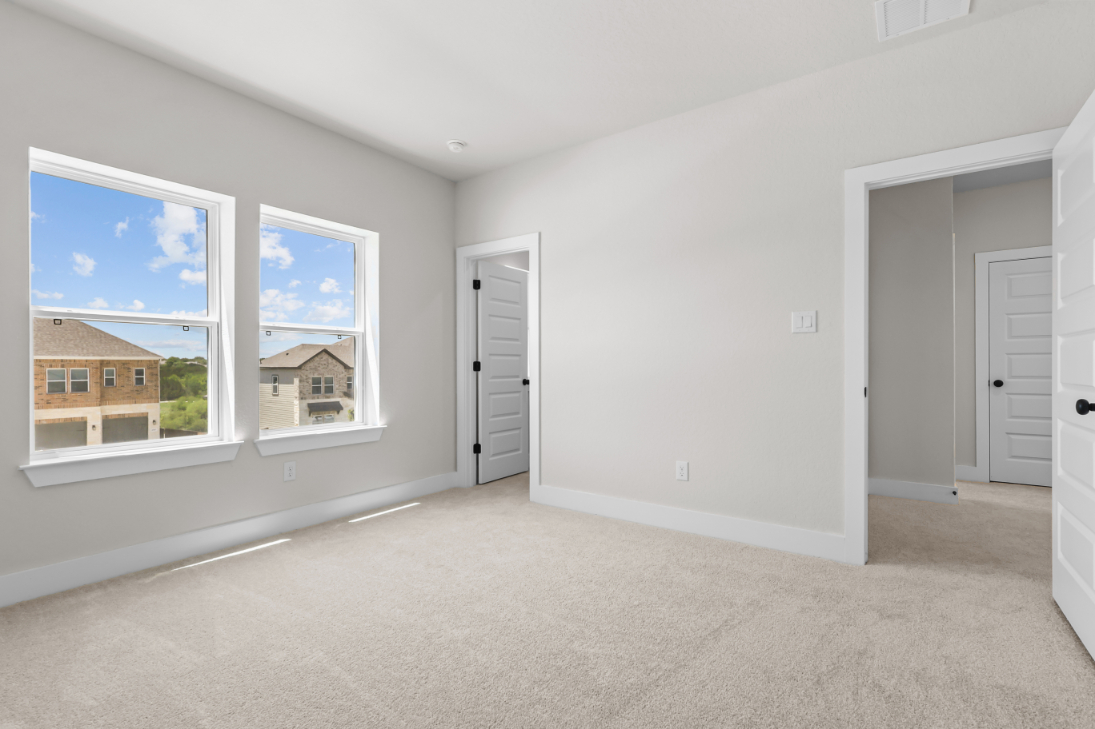 A room with white walls and windows.
