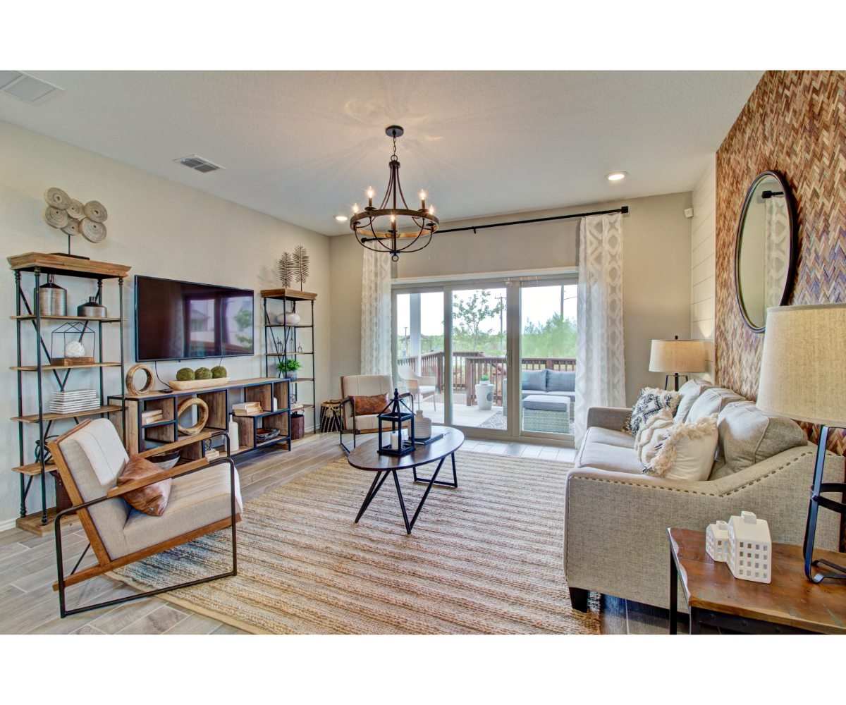 A living room with a large glass door.