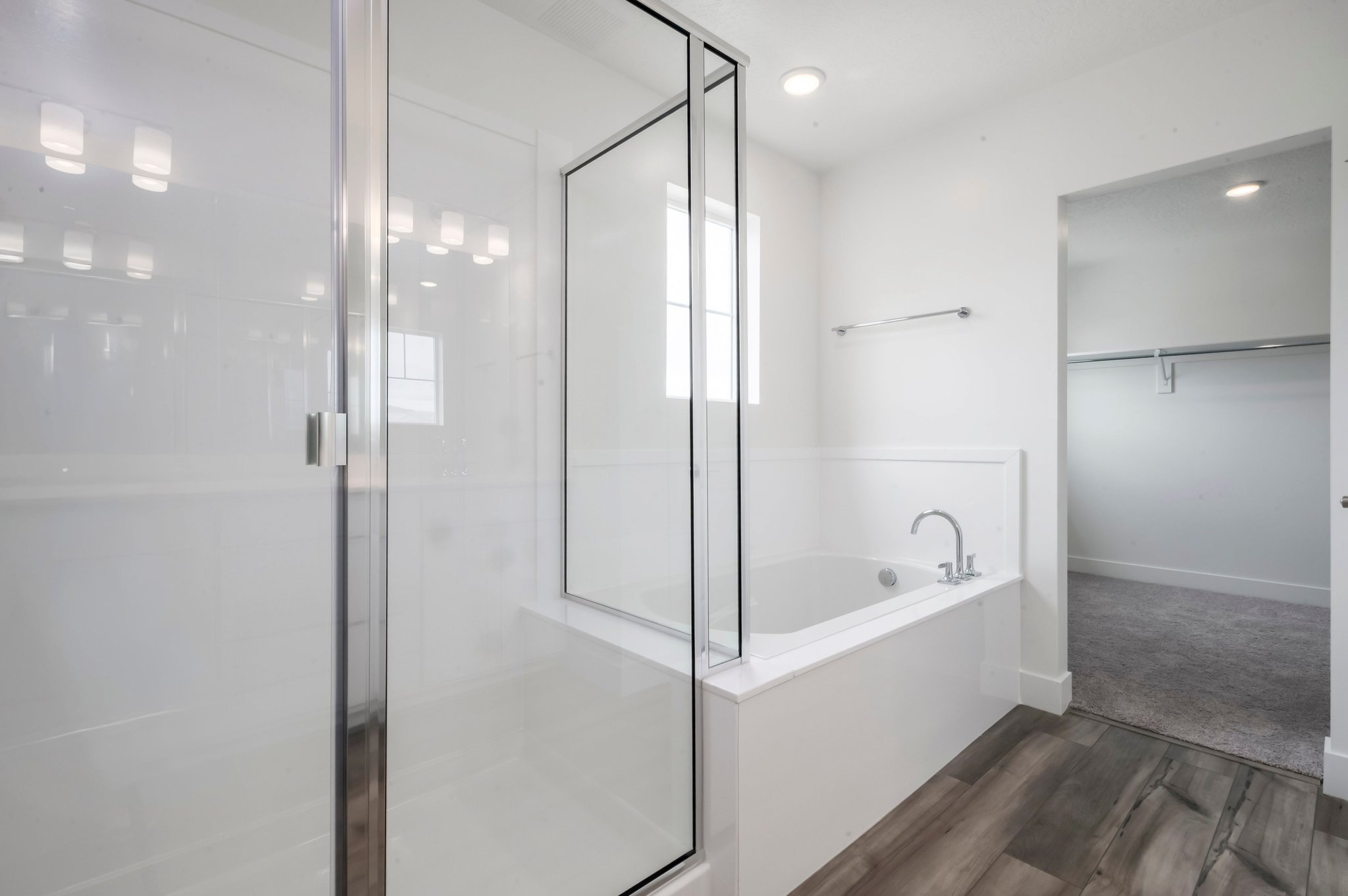 A bathroom with a glass shower.