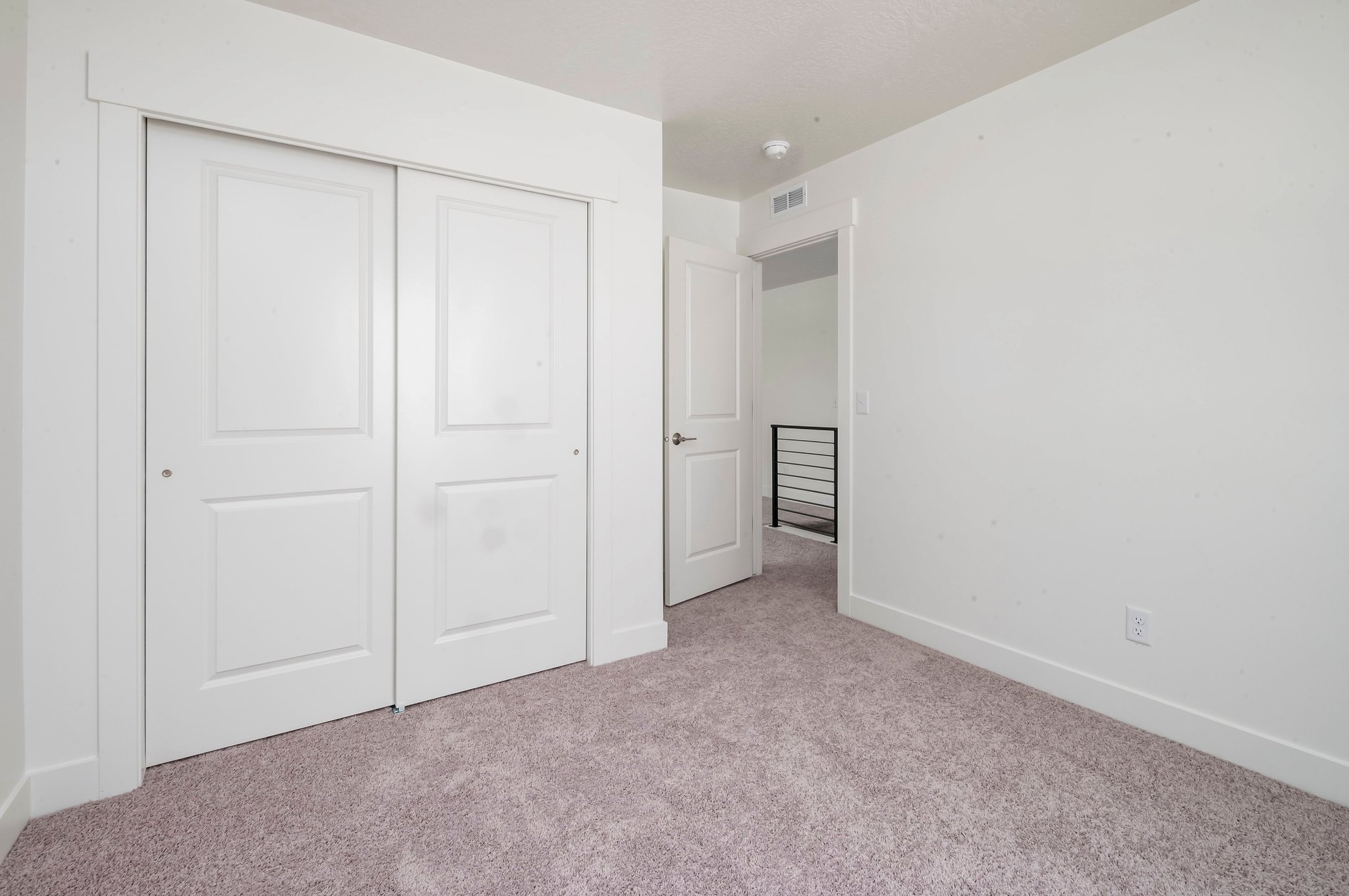 A room with white doors.