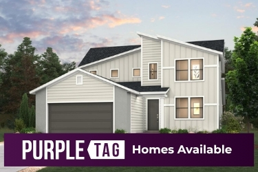 A house with trees in the back.