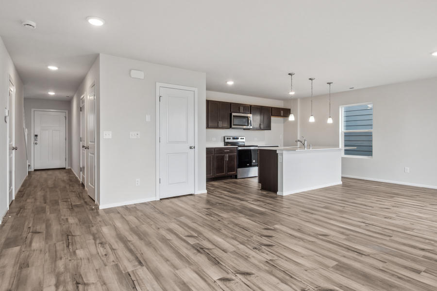 A kitchen with white cabinets.