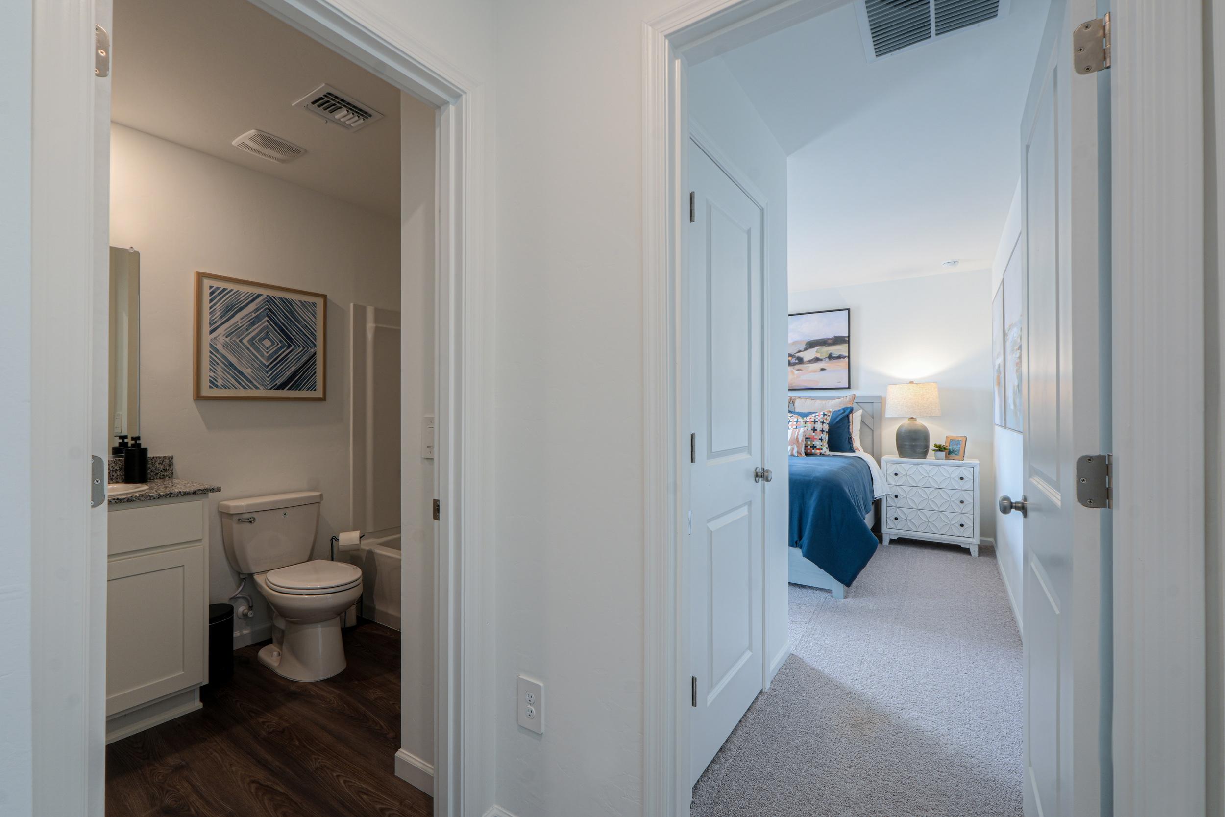 A bathroom with a toilet and a sink.