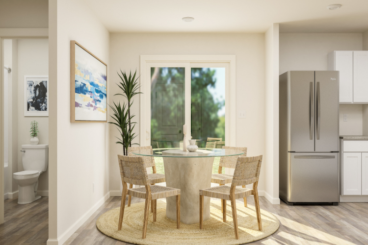 A kitchen with a dining table and chairs.