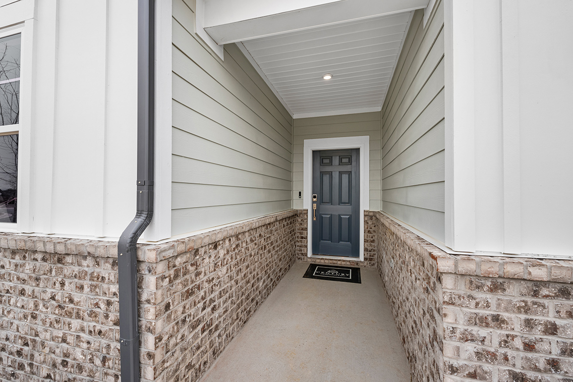 A hallway with brick walls.