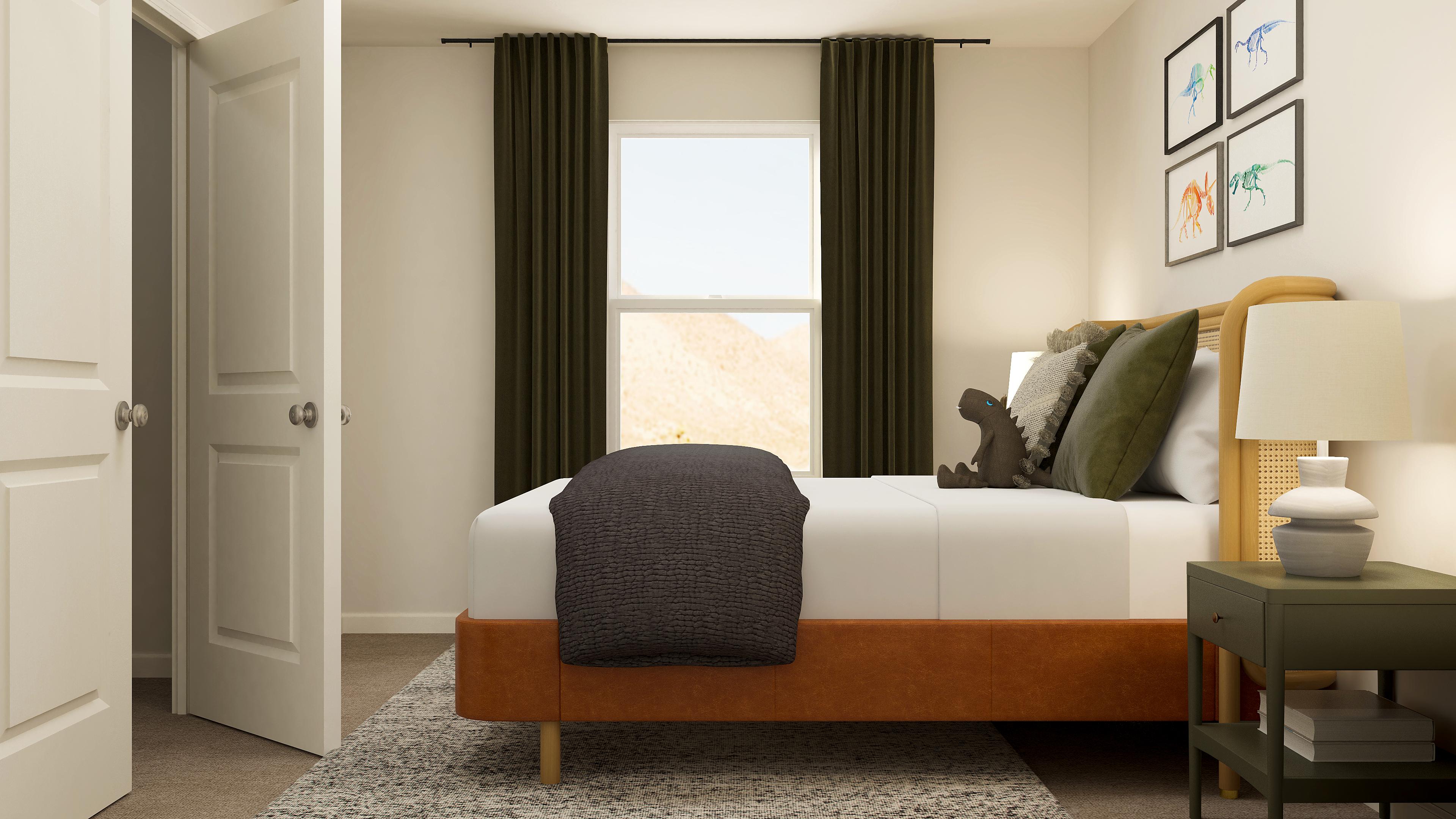 A bedroom with a bed and a window.