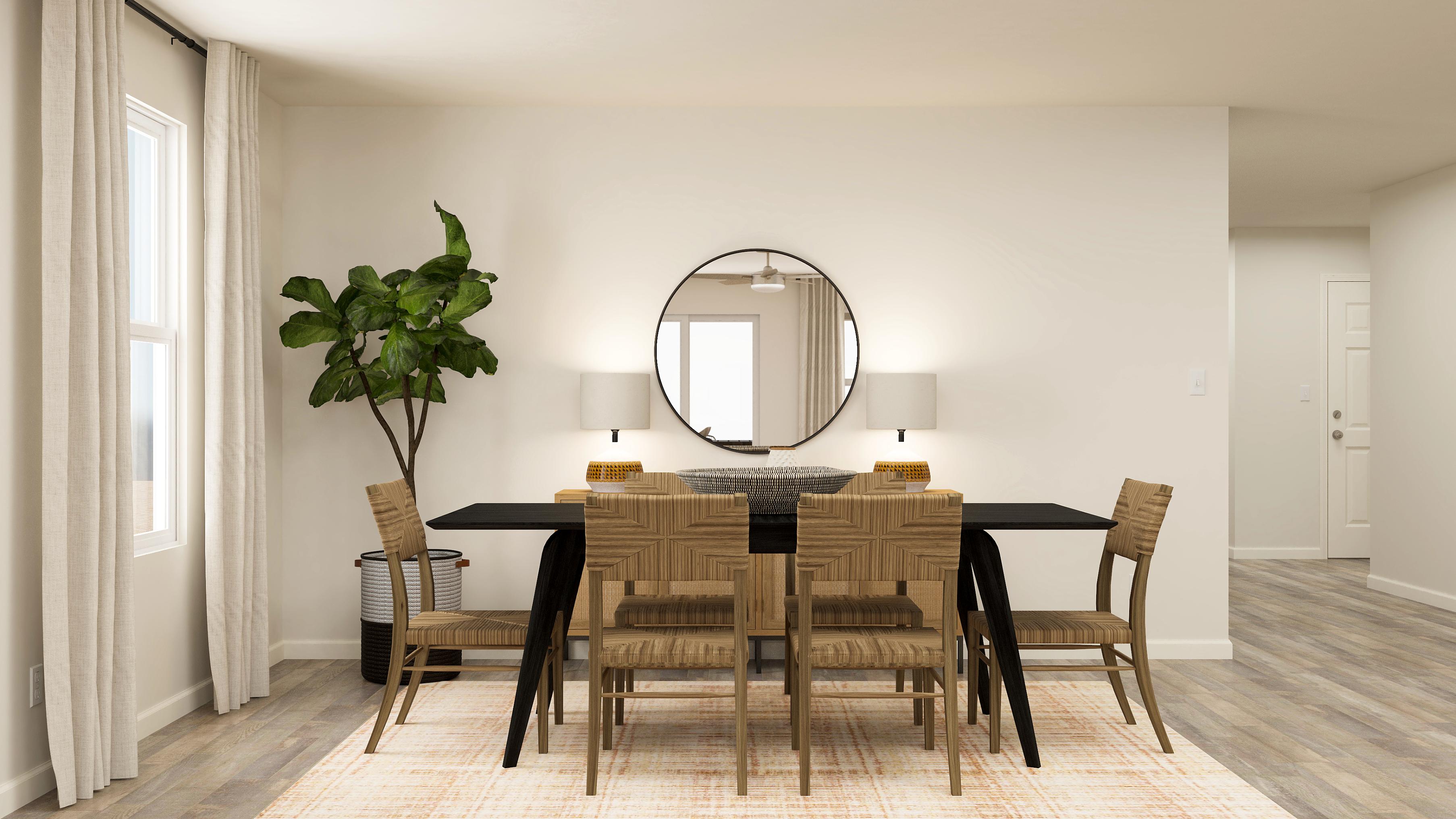 A dining room table with chairs.