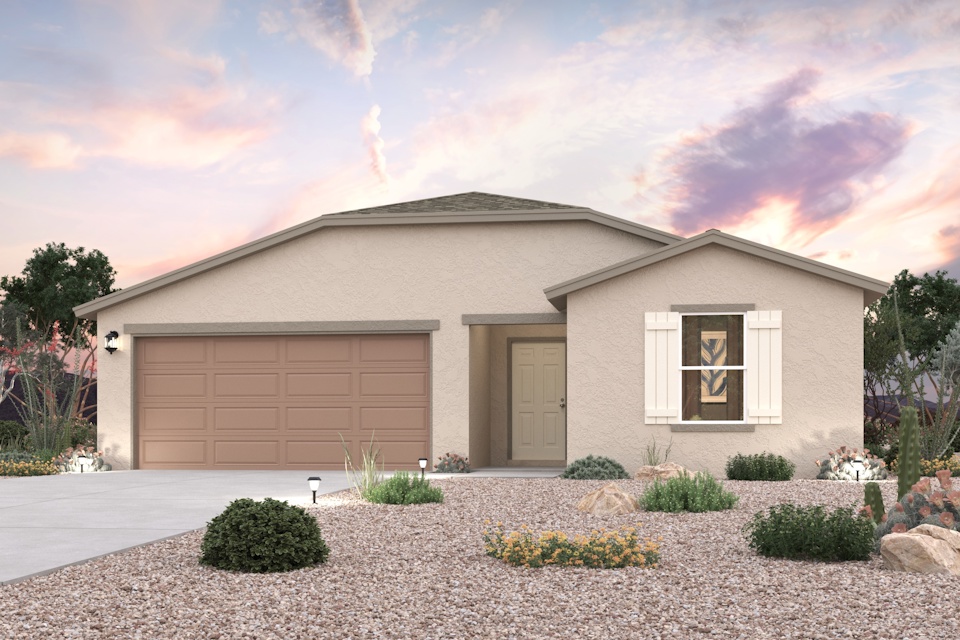 A house with a garage and a gravel driveway.