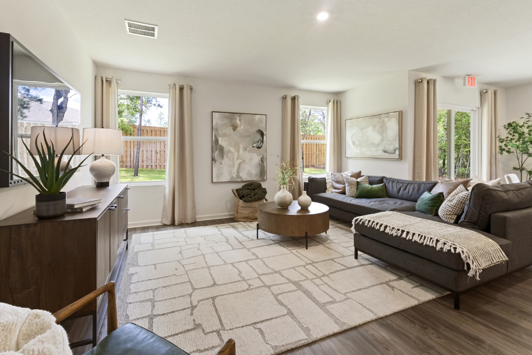 A living room with a couch and a table.