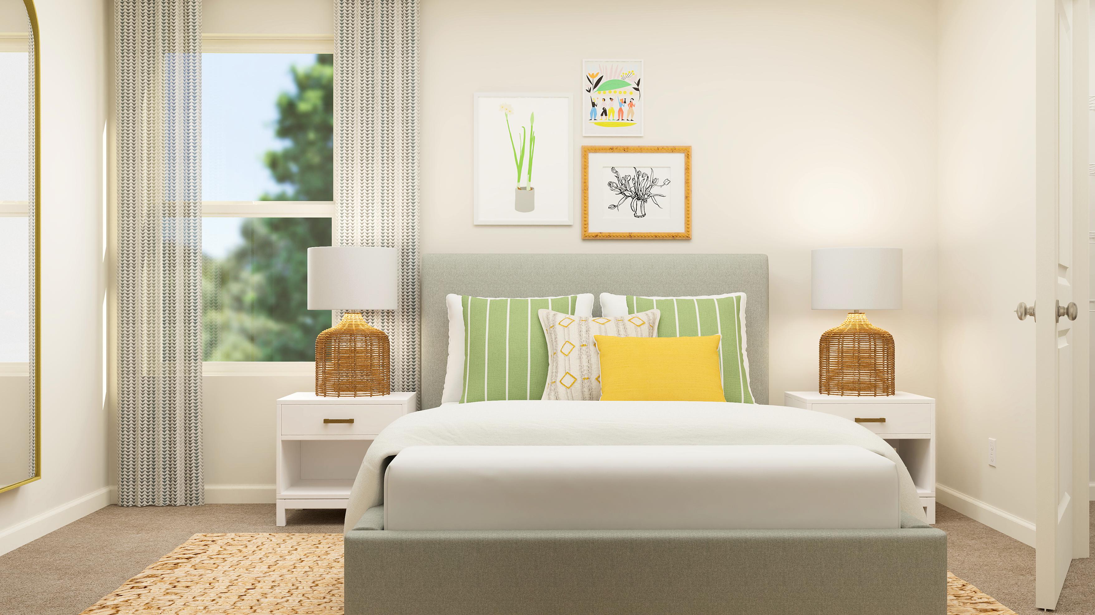 A room with a couch and a table with a lamp on it.