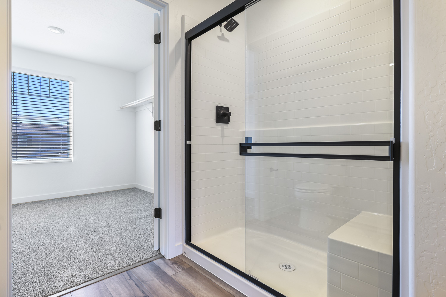 A white shower unit in a room.